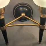 Pair of two-light torchiere wall lights in black lacquered metal and gilded brass, Circa 1960.