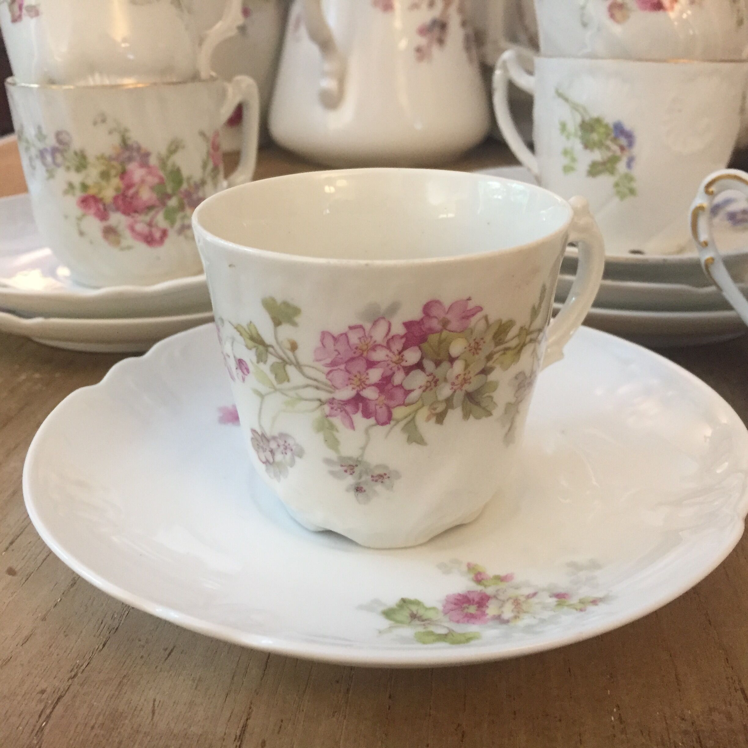 6 antique cups and mismatched saucers