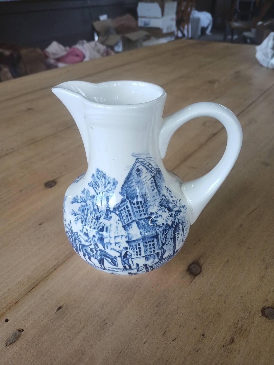 Small old pitcher in iron earth