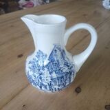 Small old pitcher in iron earth