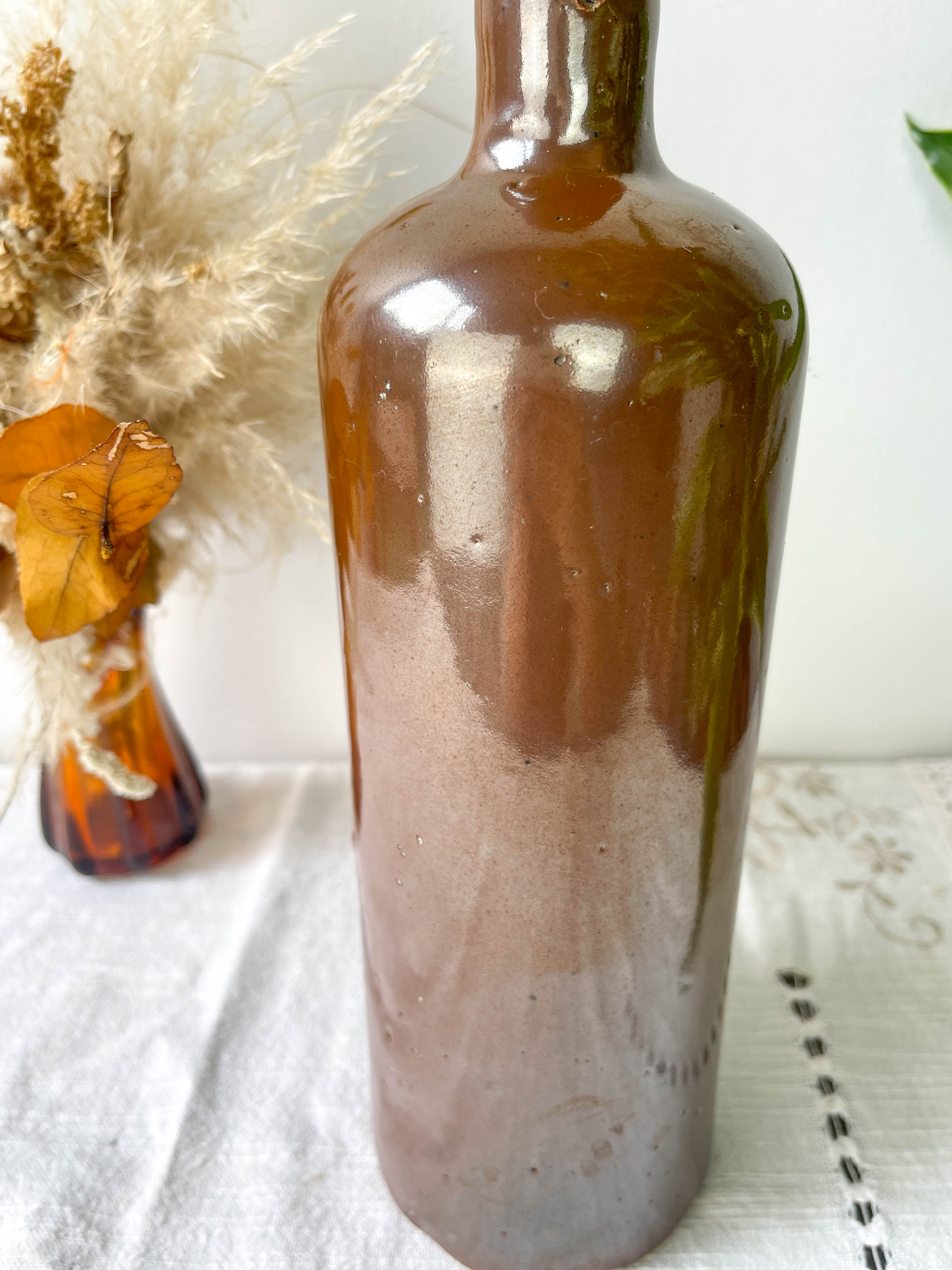 Vintage iridescent brown stoneware bottle