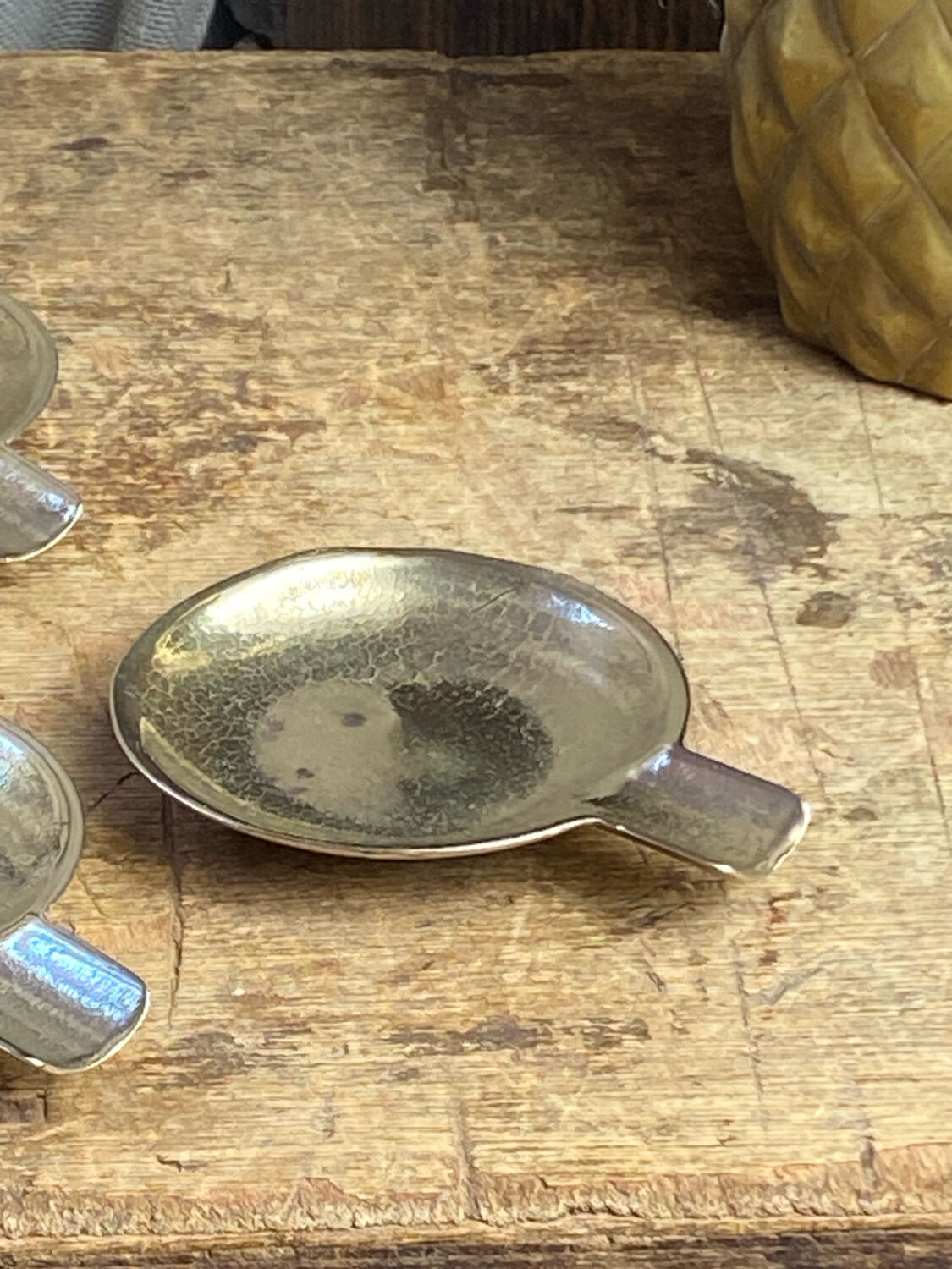 Individual brass ashtrays with storage support