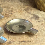 Individual brass ashtrays with storage support