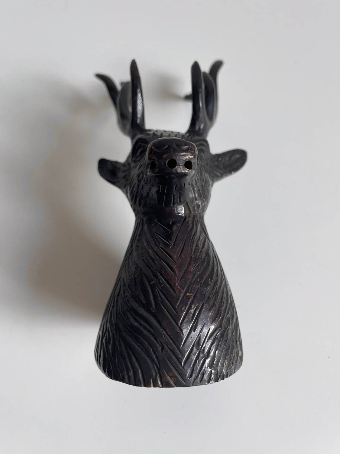 Salt and pepper shaker set with patinated brass deer heads.