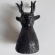 Salt and pepper shaker set with patinated brass deer heads.