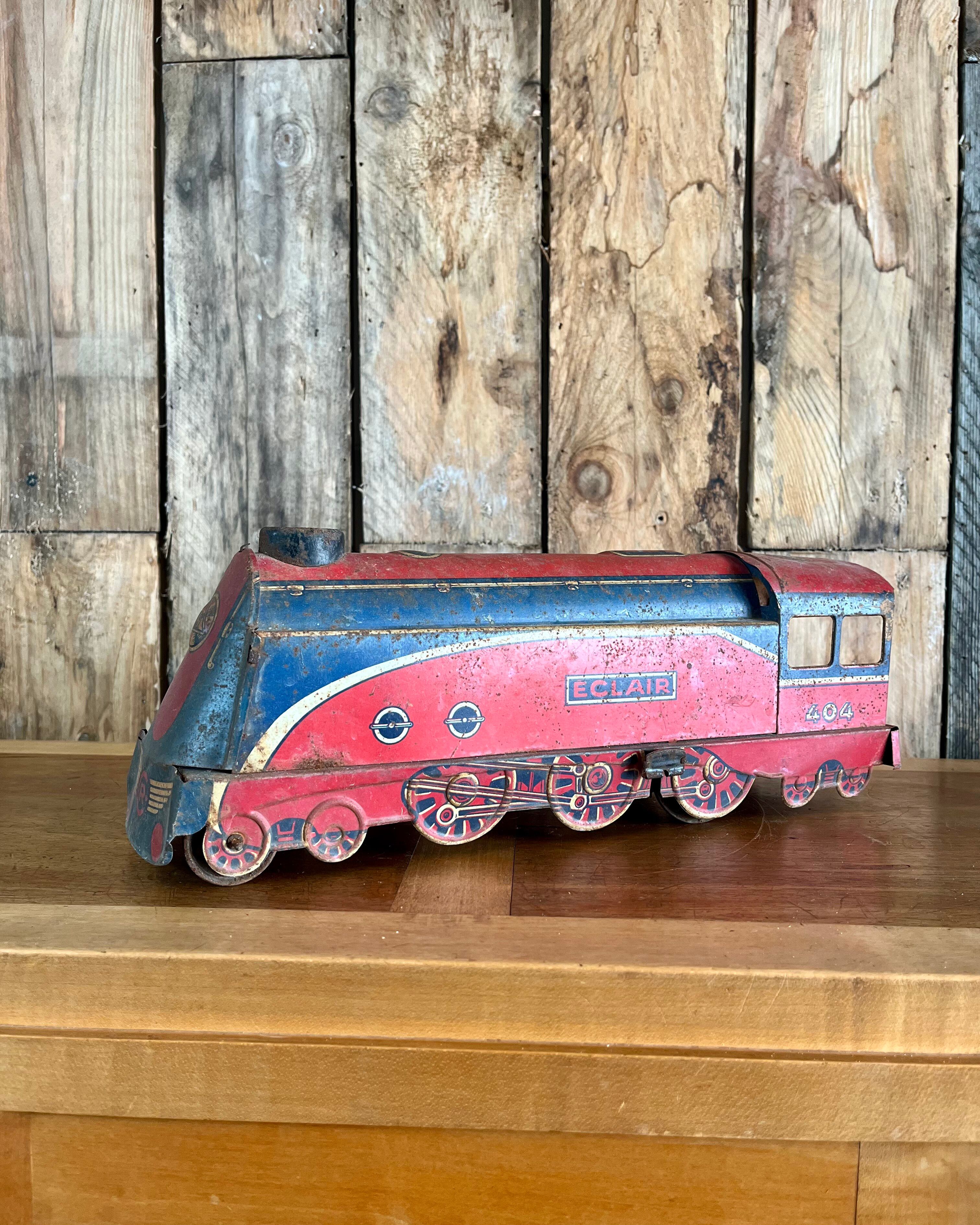 Old tin locomotive Eclair 404