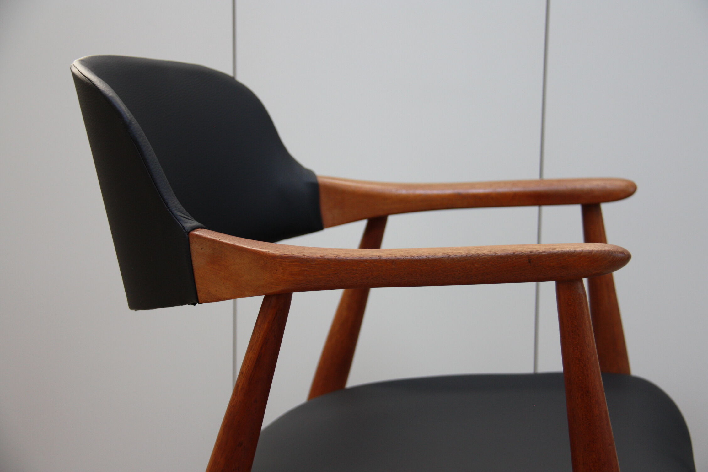Vintage armchair in teak and black leather model Casina 60s