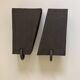 Pair of black stoneware graphic wall lights with handmade ring.