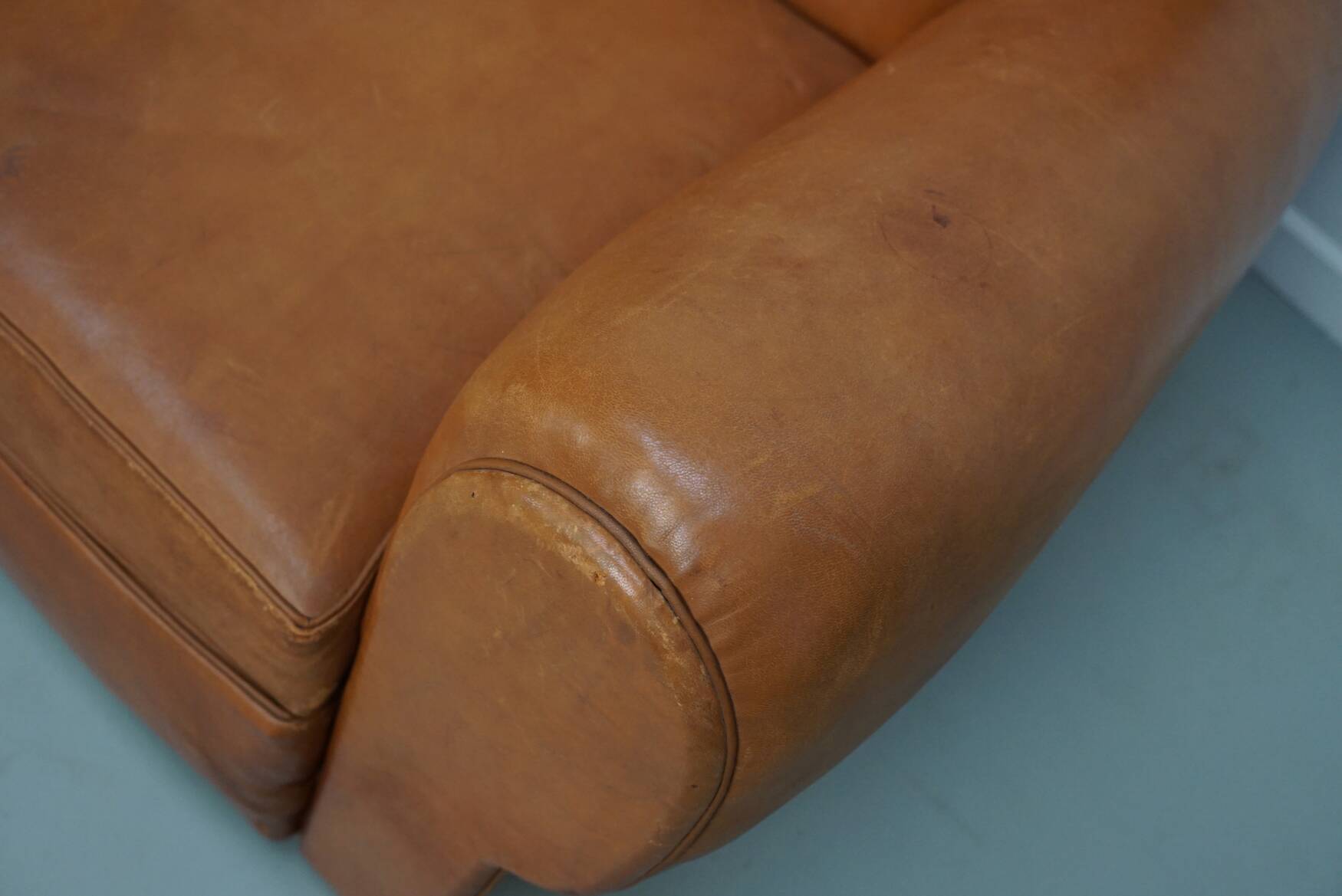 Pair of French club chairs with moustache back in cognac leather, 1950s