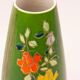 Art Deco porcelain vase in green with floral patterns.