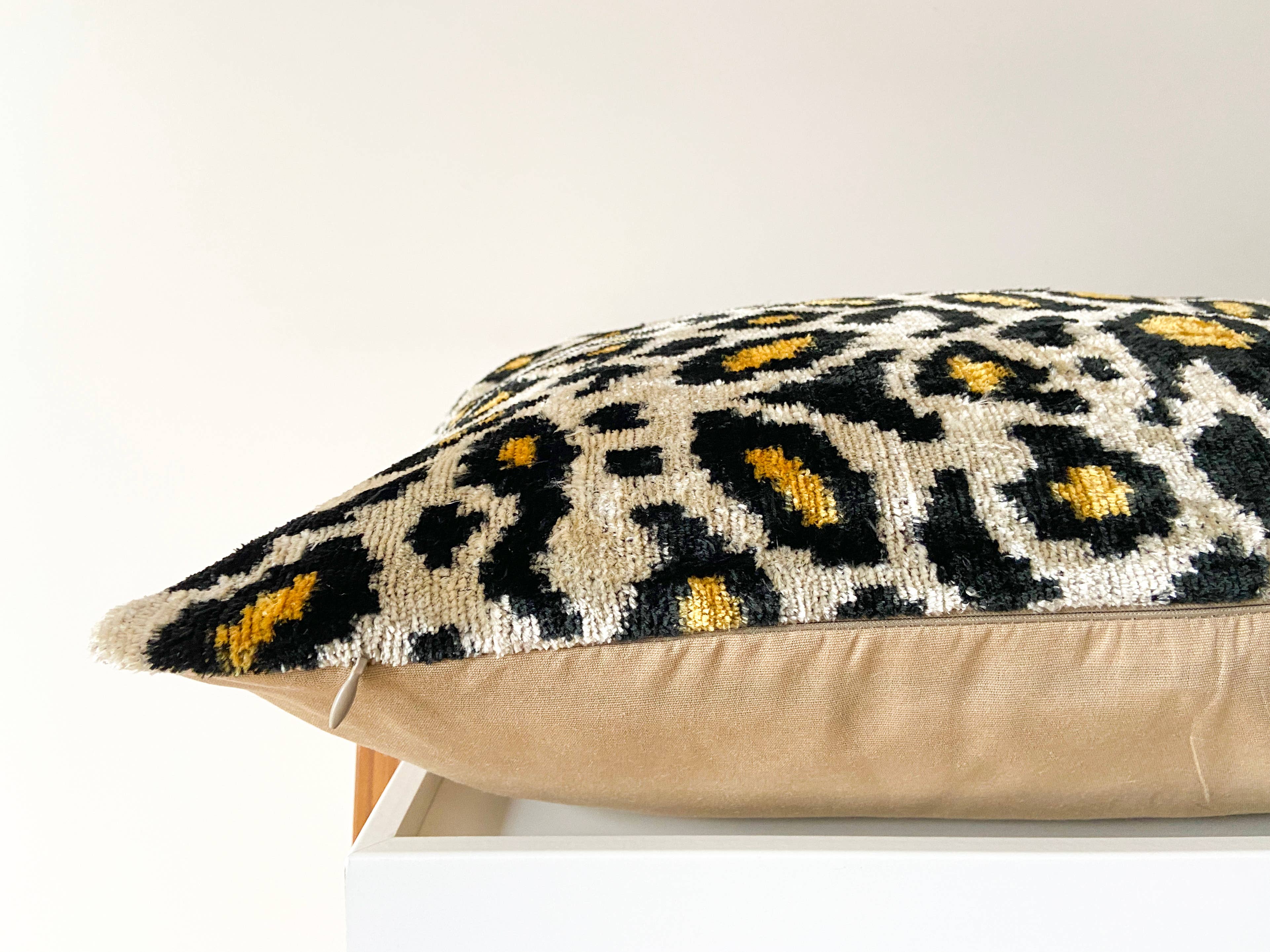 Ikat cushion in panther velvet