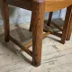 Set of four vintage wooden dining chairs with black leather upholstery, 85 × 45 × 45 cm