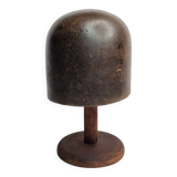 Old solid wood hat shape on foot, 1900