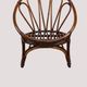 Fauteuil corbeille vintage en rotin à dossier soleil – Style Riviera, année
