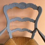Provencal style straw armchair with gray blue patina armrests