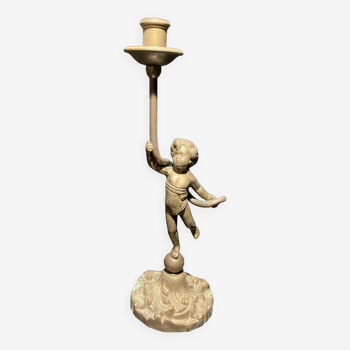 Bronze candlestick representing a child