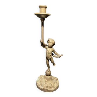 Bronze candlestick representing a child