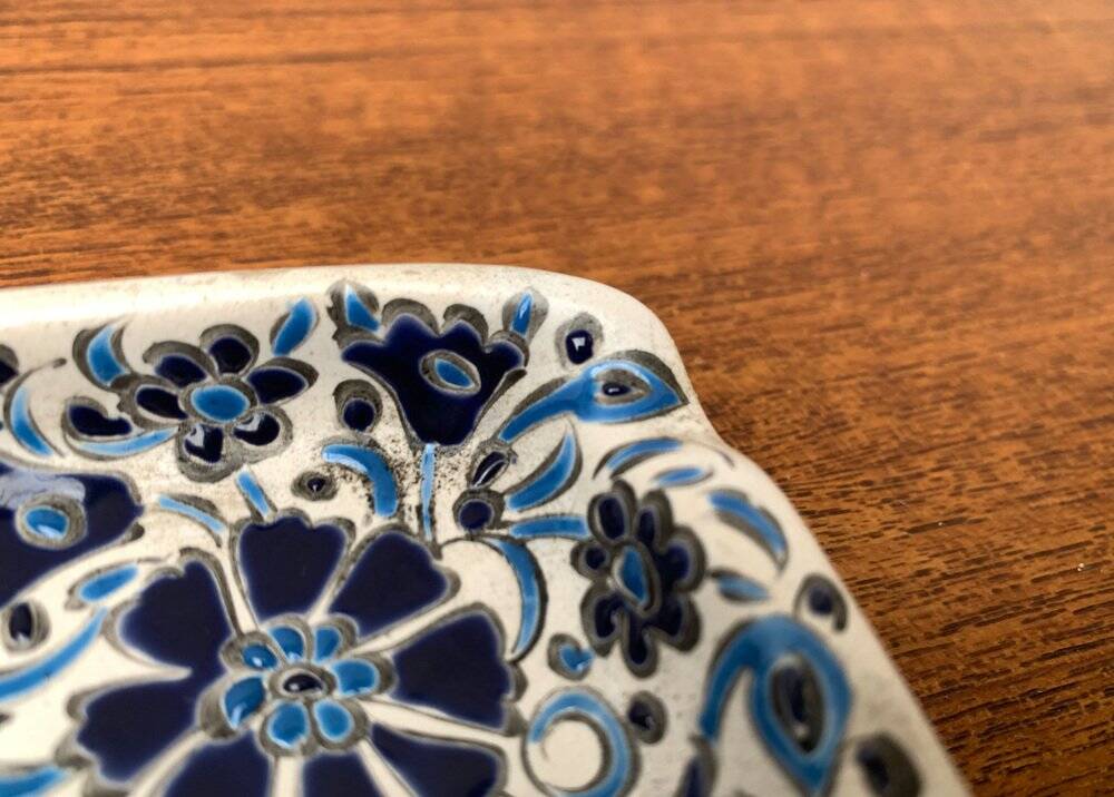 Vintage handmade blue ceramic ashtray with deer and flower ornament from Rodos Ceramics.