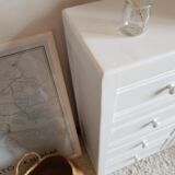 Old white asymmetrical chest of drawers