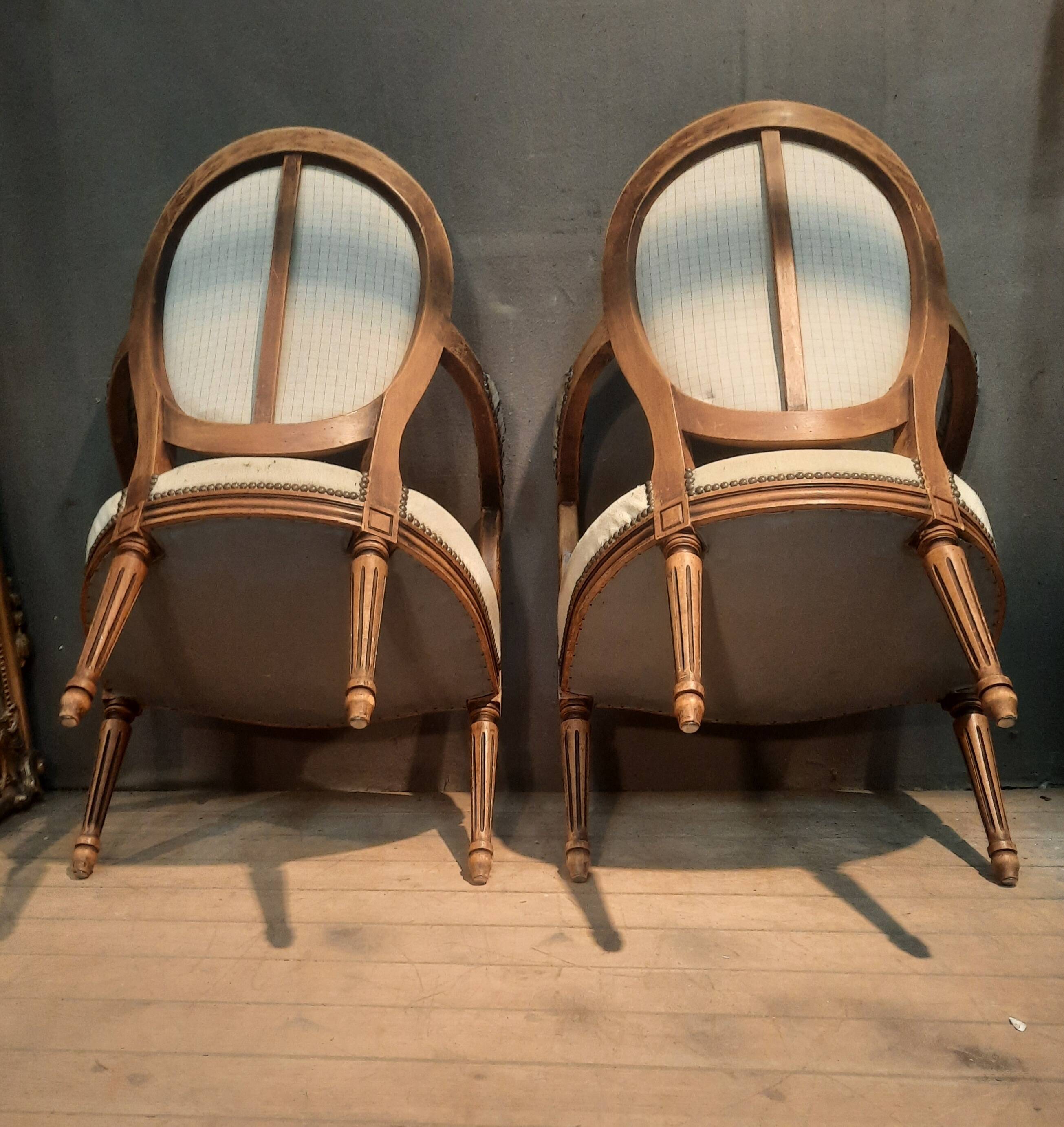Pair of Louis XV style medallion armchairs.