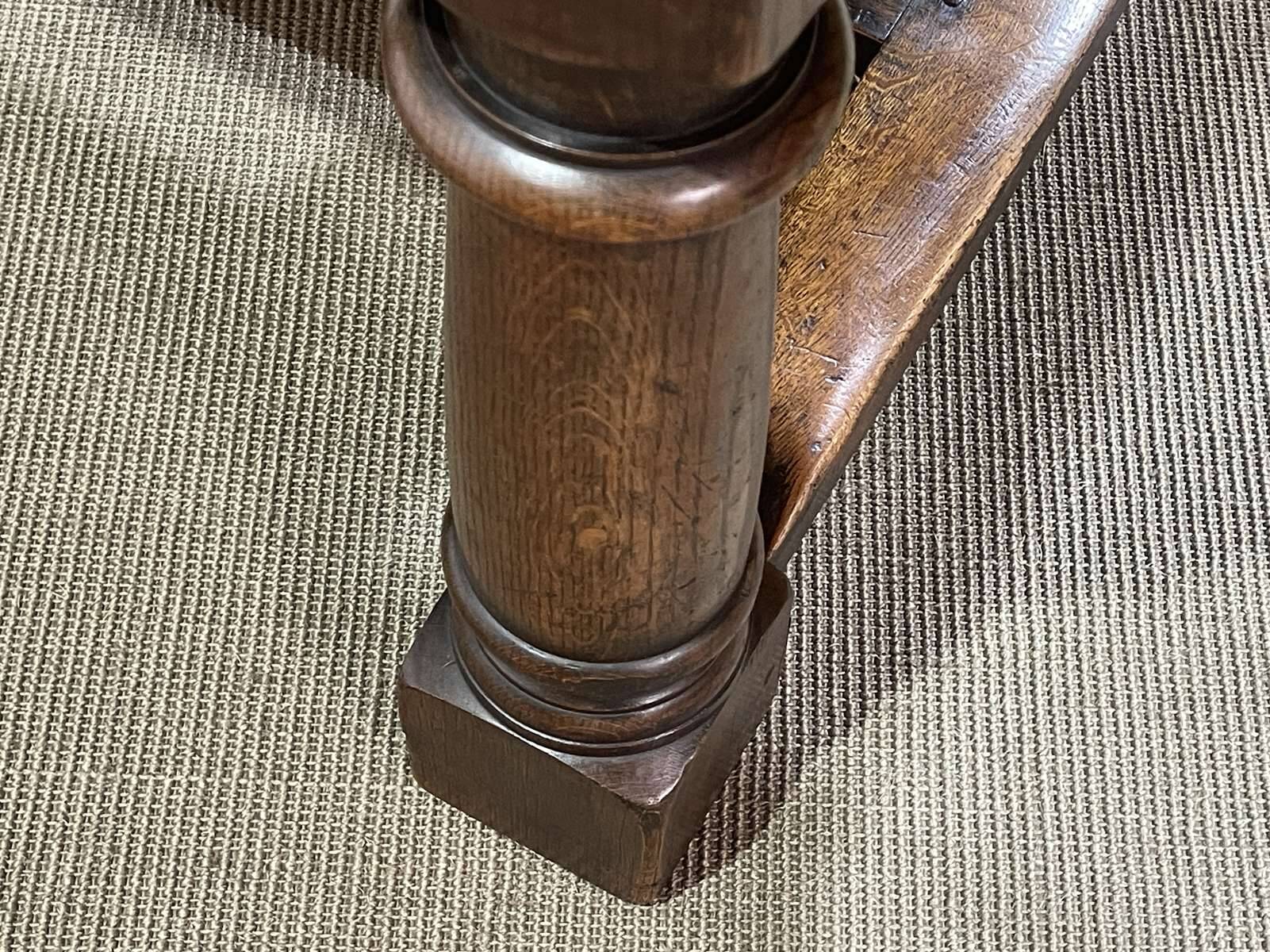 English monastery table with extensions from the late 19th century in elm and oak.