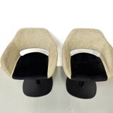 Series of six swivel chairs with an organic shell, patterned fabric and base.