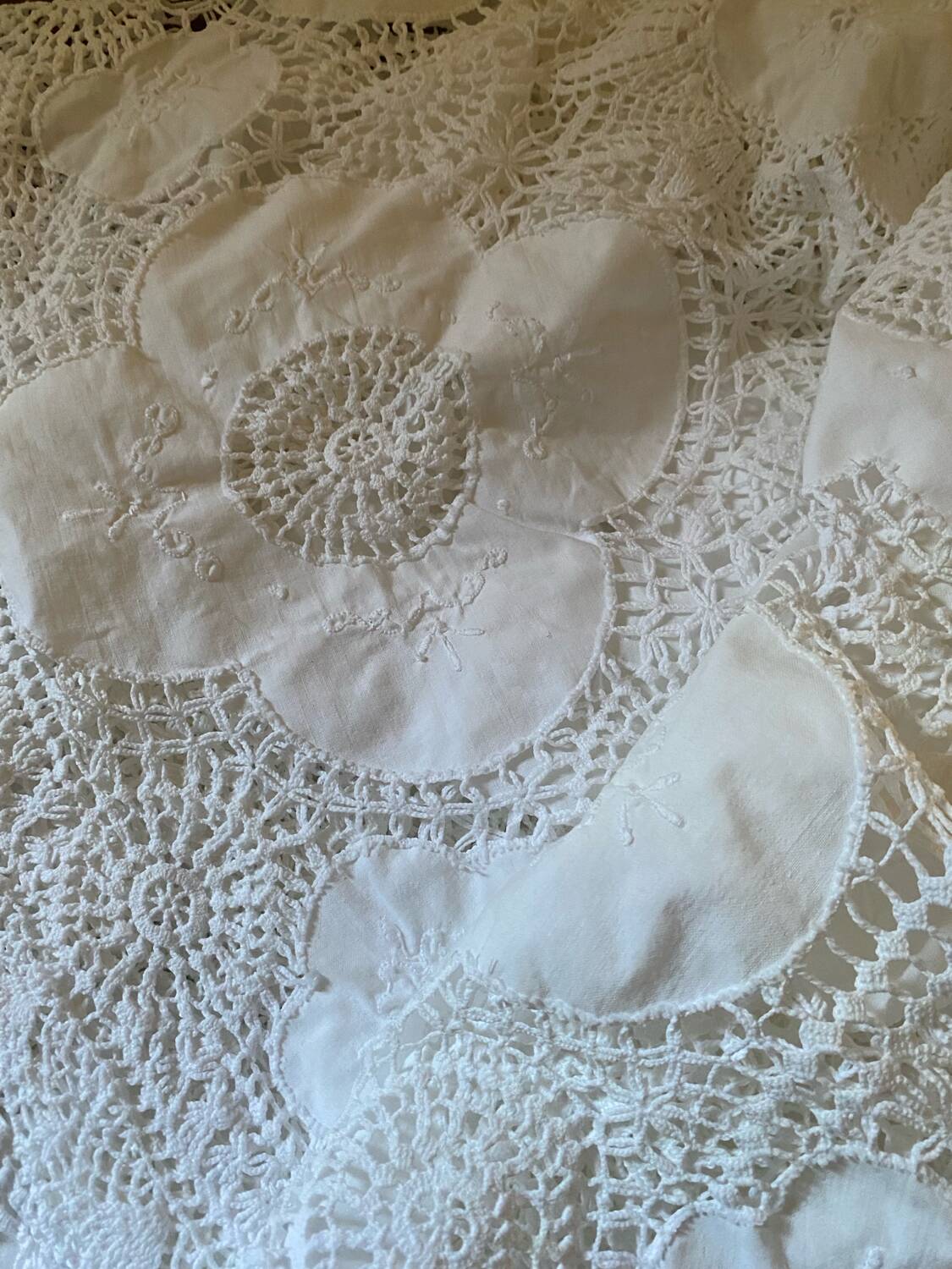 White cotton tablecloth with crochet lace.