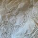 White cotton tablecloth with crochet lace.