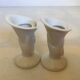 Paire de petits vases bougeoirs mains