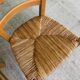 4 solid wood chairs in blond oak and straw shell