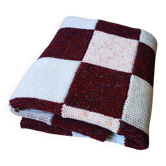 Hand-knitted patchwork blanket
