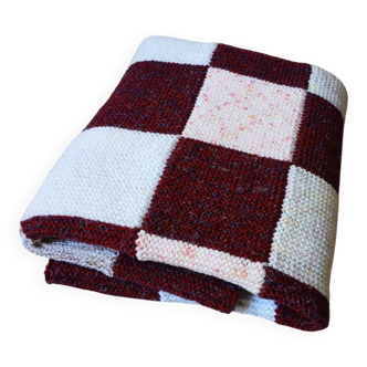 Hand-knitted patchwork blanket