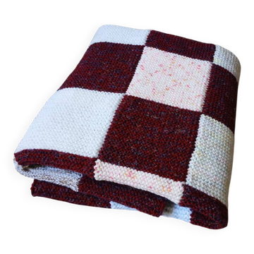Hand-knitted patchwork blanket
