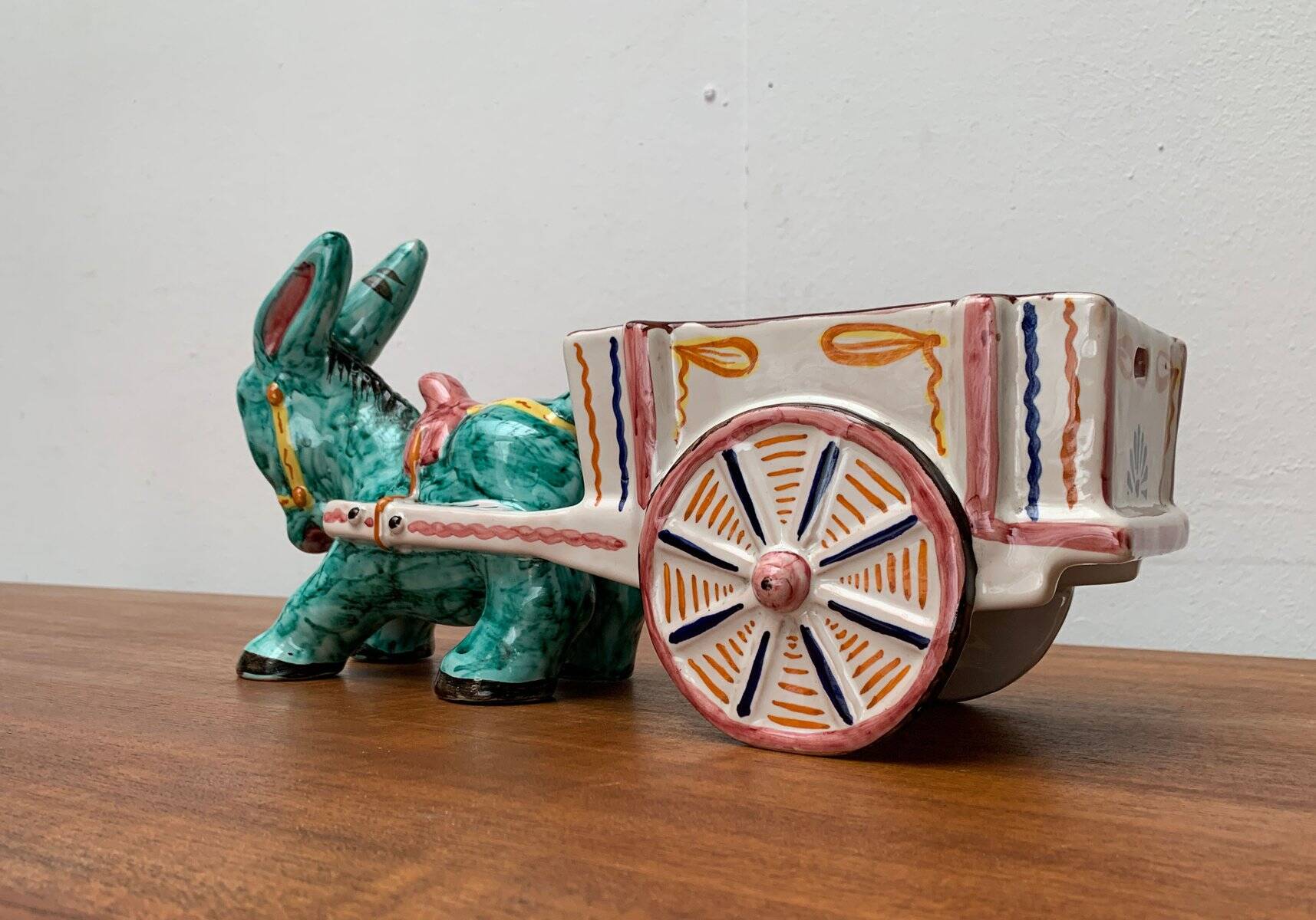 Vintage Italian hand-painted sculpture of a donkey with a cart in the shape of a bowl from Deruta, Italy.