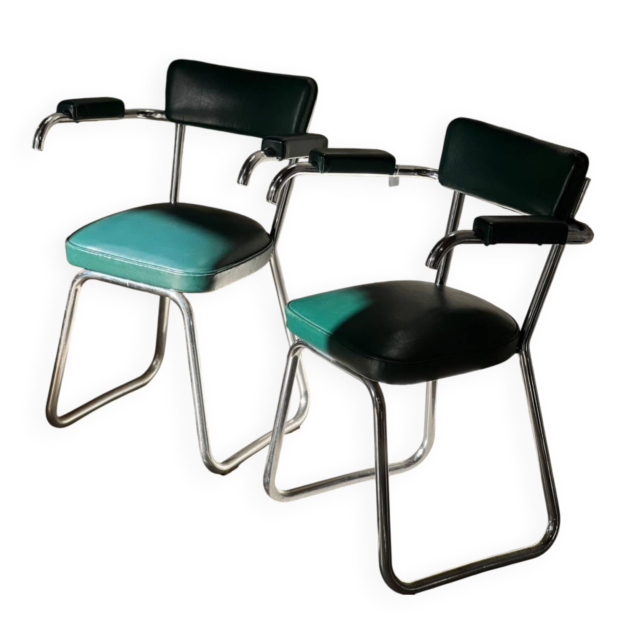 Pair of green vinyl and chrome armchairs, mid-century