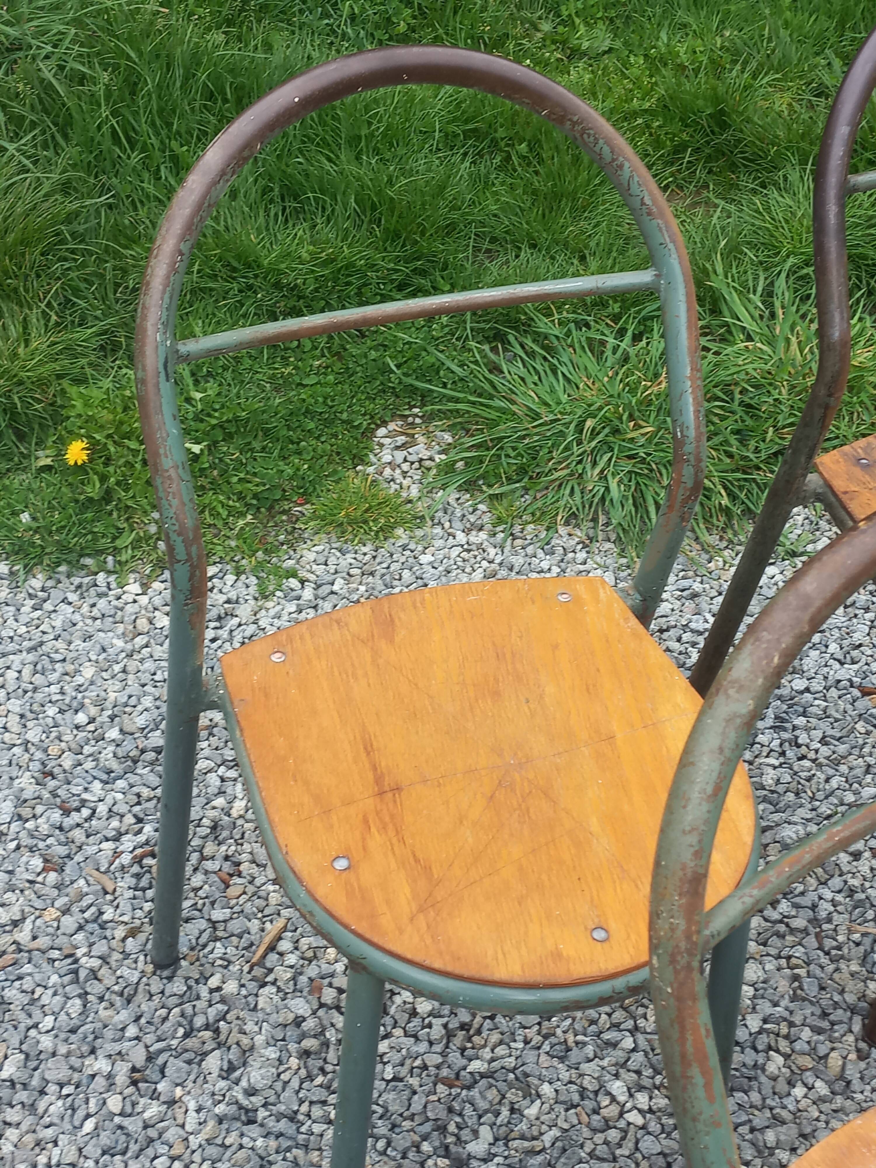 Set de 7 chaises de René Herbst métalliques assises bois