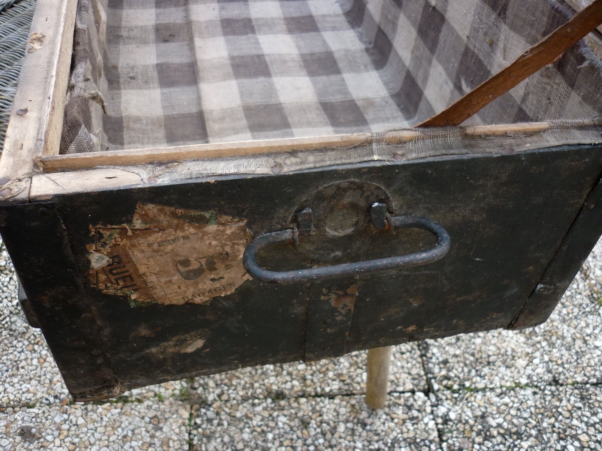 Old bulging wooden travel trunk