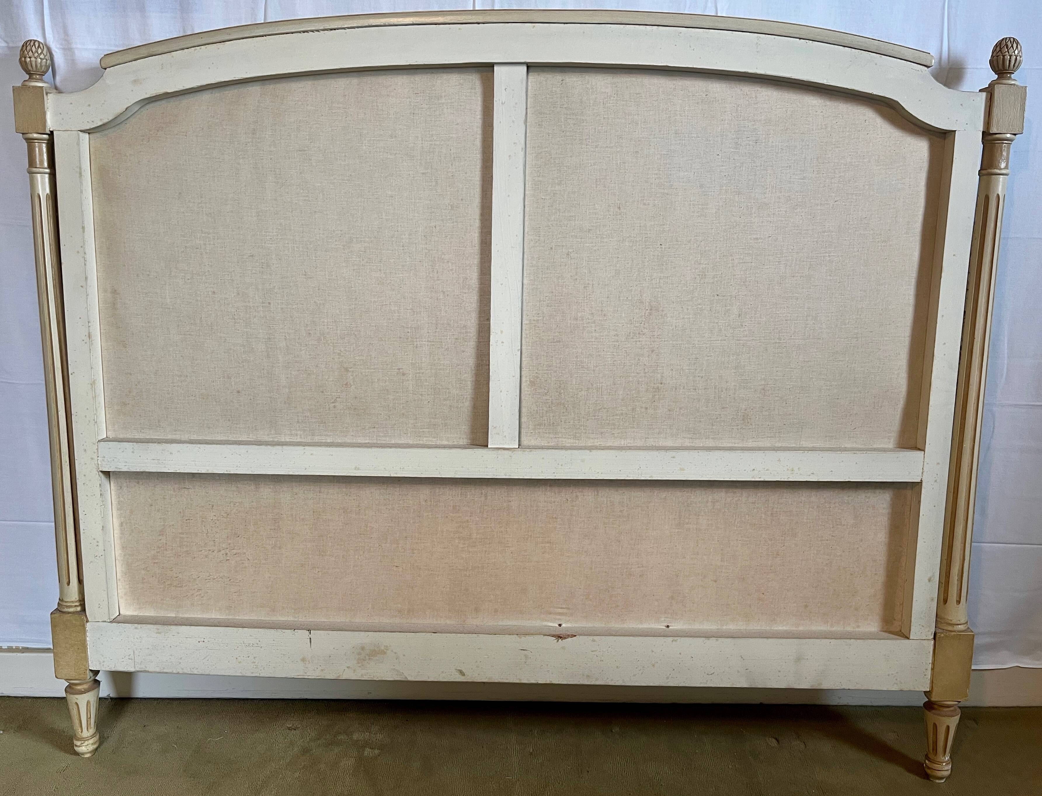 Louis XVI style bed in patinated wood with fluted columns.