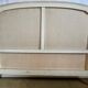 Louis XVI style bed in patinated wood with fluted columns.