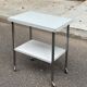 Rolling dessert trolley with 2 white formica shelves and steel, 1980.