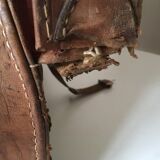 suitcase of leather with labels of palaces