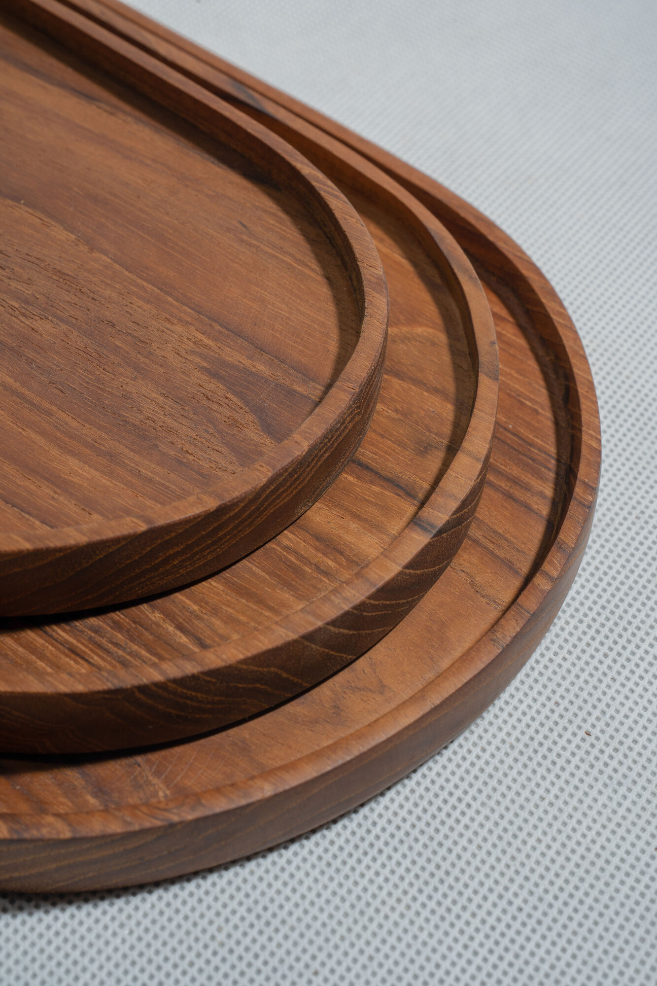 Trio of oval teak trays or cups