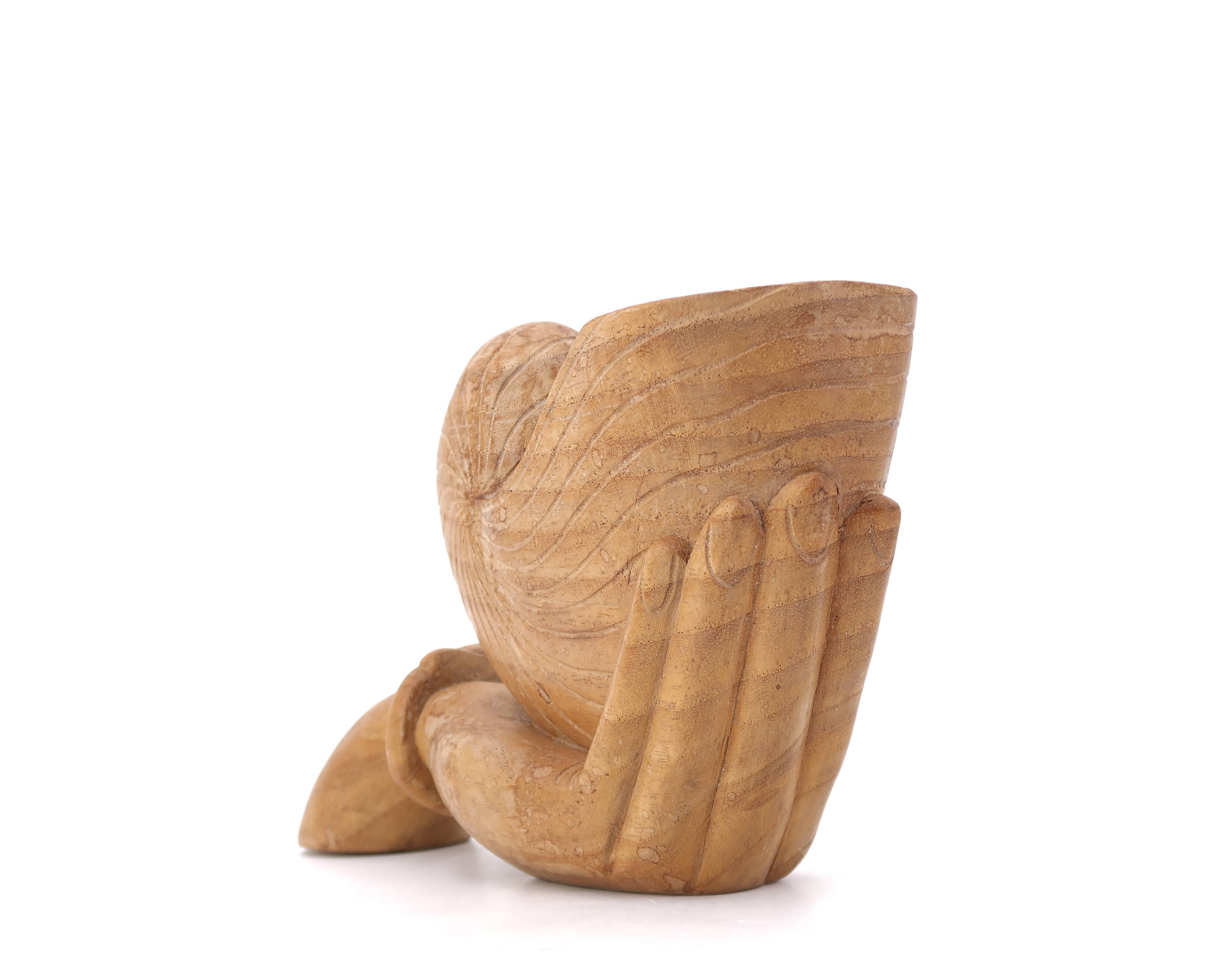 Wooden hand emptier holding a shell, 1970s
