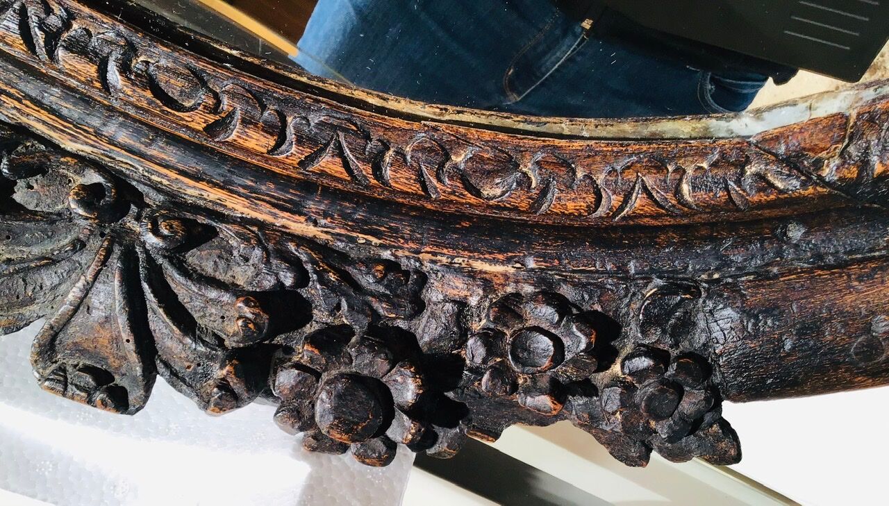 Oval mirror on an 18th century frame