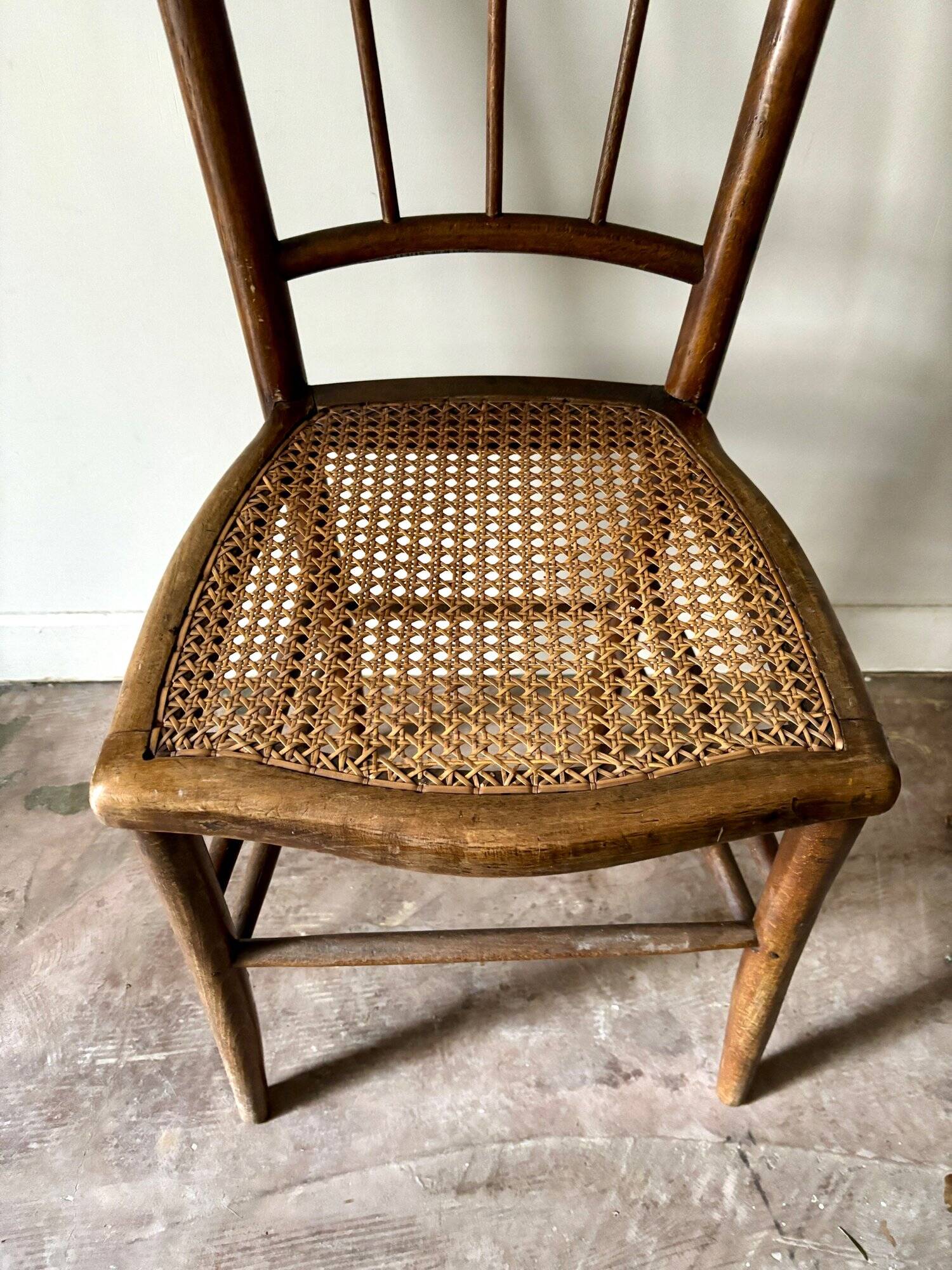 Wooden and cane bistro chair