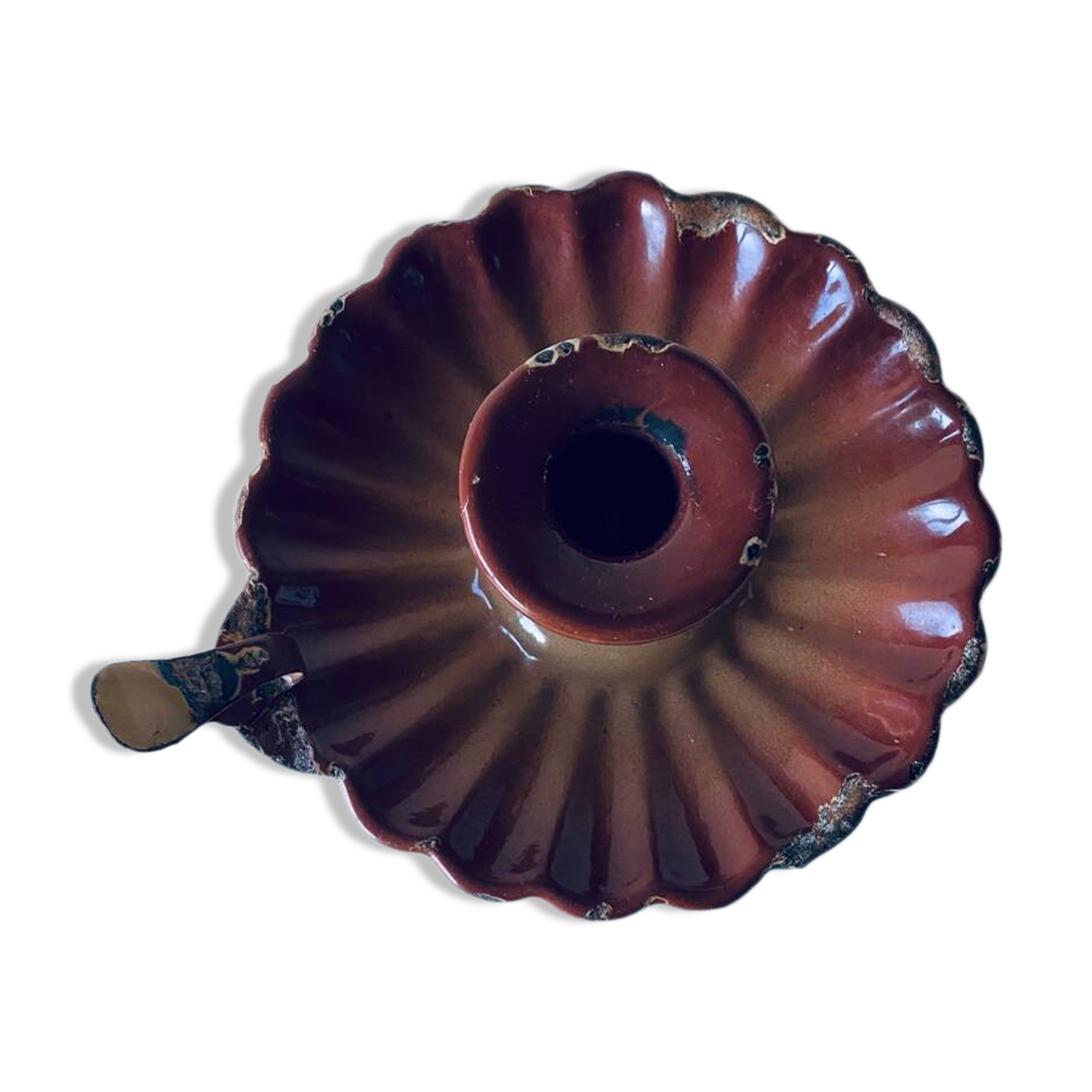 Old candle holder in brown enameled metal