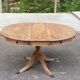 Round extendable dining table Regency central leg stripped mahogany 1960