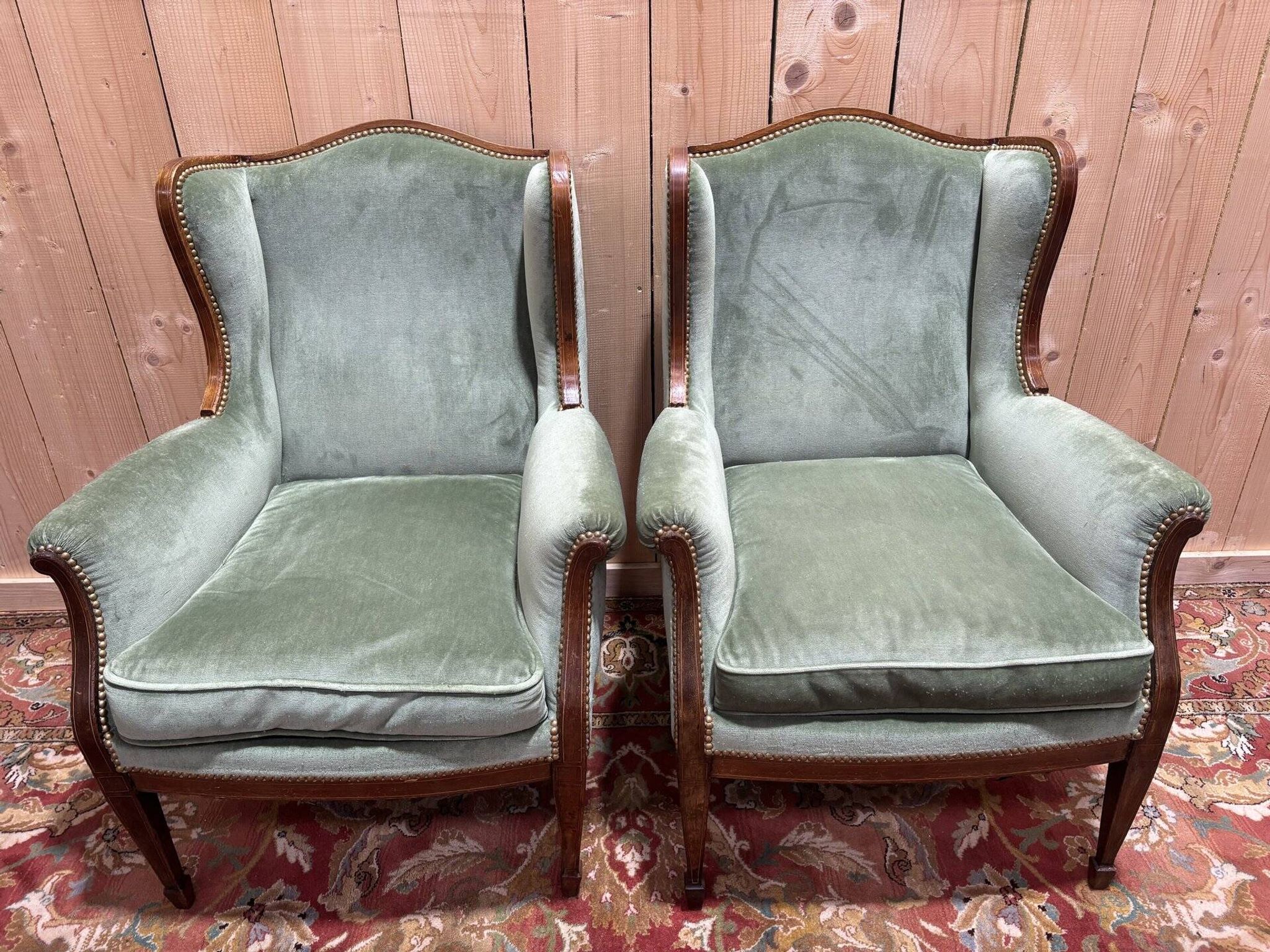 Pair of Louis XVI style wingback armchairs