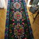 Romanian floral runner rug on blue background