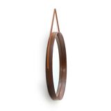 Round mirror with leather strap, 1960s